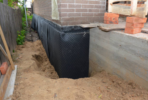 Happy homeowners after waterproofing job in Santa Fe